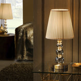 Mercury Champagne Glass Table Lamp - Champagne and Antique Brass shown in a room setting
