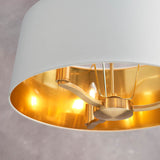 Close-up of the Endon Brendale 3 Light Pendant showing three E14 lamps within a white faux silk shade lined with a warm metallic gold interior.