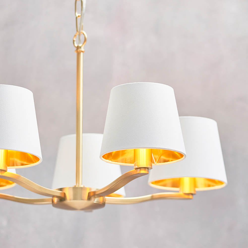 Brendale 5 Light Pendant in satin gold with white faux silk shades and gold inner lining, brushed metal arms and adjustable chain drop.