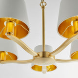 Brendale 5 Light Pendant in satin gold, close-up of curved arms with white fabric shades and gold-lined interiors on a plain white background.