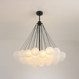 Niori Orb 37 Light Cluster Chandelier in black with frosted glass globes suspended on fine chains from a matt black ceiling rose and drop rod.
