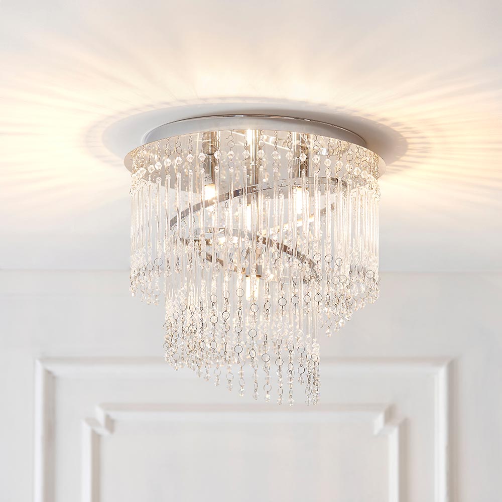 Vivienne 4 light flush ceiling light in polished chrome with tiered crystal glass strands, mounted on a white ceiling above a panelled door.
