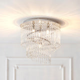 Vivienne 4 light flush ceiling light in polished chrome with tiered crystal glass strands, mounted on a white ceiling above a panelled door.