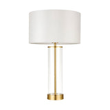 Endon Caldley table lamp with clear cylindrical glass base, satin brass fittings and white drum shade, shown on a plain white background.