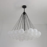 Niori Orb 37 Light Cluster Chandelier in black with frosted glass globes suspended on fine chains from a matt black ceiling rose and rod.