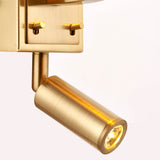 Brendale Wall Light in satin gold, close-up of adjustable cylindrical LED reading spot and toggle switches, plain white background.