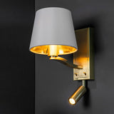 Brendale Wall Light in satin gold with a white faux silk shade, gold-lined interior, and an adjustable LED reading spot with dual on/off switches.