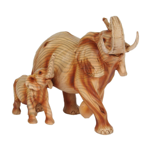 Elephant & Calf wood effect resin figurine in brown, mother with curved tusks mid-stride beside calf, both trunks raised, wood-grain finish on plain white background.