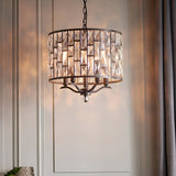 Endon Aldwick 5 light pendant in dark bronze with tiered K5 faceted crystal drum shade, suspended by chain in a classic panelled interior.