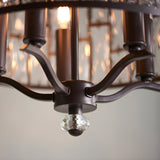 Close-up of the Endon Aldwick 5 Light Pendant in dark bronze, showing curved arms, tiered faceted crystal shade, and a crystal finial detail.