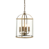 Caldbury 4 Light Pendant in brass with cylindrical clear glass panels, four candle-style bulbs, and a hanging chain, shown on a plain white background.