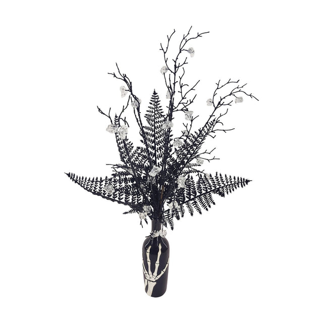 Potted Deadwood and Fern Ceramic Faux Plant 80cm in black glitter with clear faceted gems, set in a slim black ceramic bottle printed with a white skeleton hand, on a plain white background.