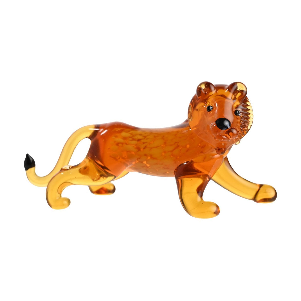 Miniature orange glass lion figurine with mottled body, pale golden legs and curved tail with black tip, on a plain white background.