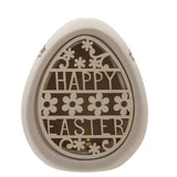 Ceramic egg-shaped light-up decoration in natural finish with a cut-out "HAPPY EASTER" design and floral details, shown on a plain white background.