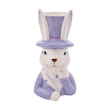 Ceramic planter shaped as a white bunny in a purple top hat and jacket with bow tie, one paw raised to chin, open hat top for planting, on a plain white background.