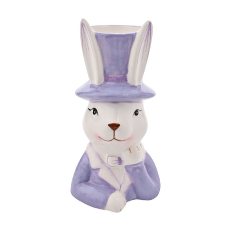 Ceramic planter shaped as a white bunny in a purple top hat and jacket with bow tie, one paw raised to chin, open hat top for planting, on a plain white background.