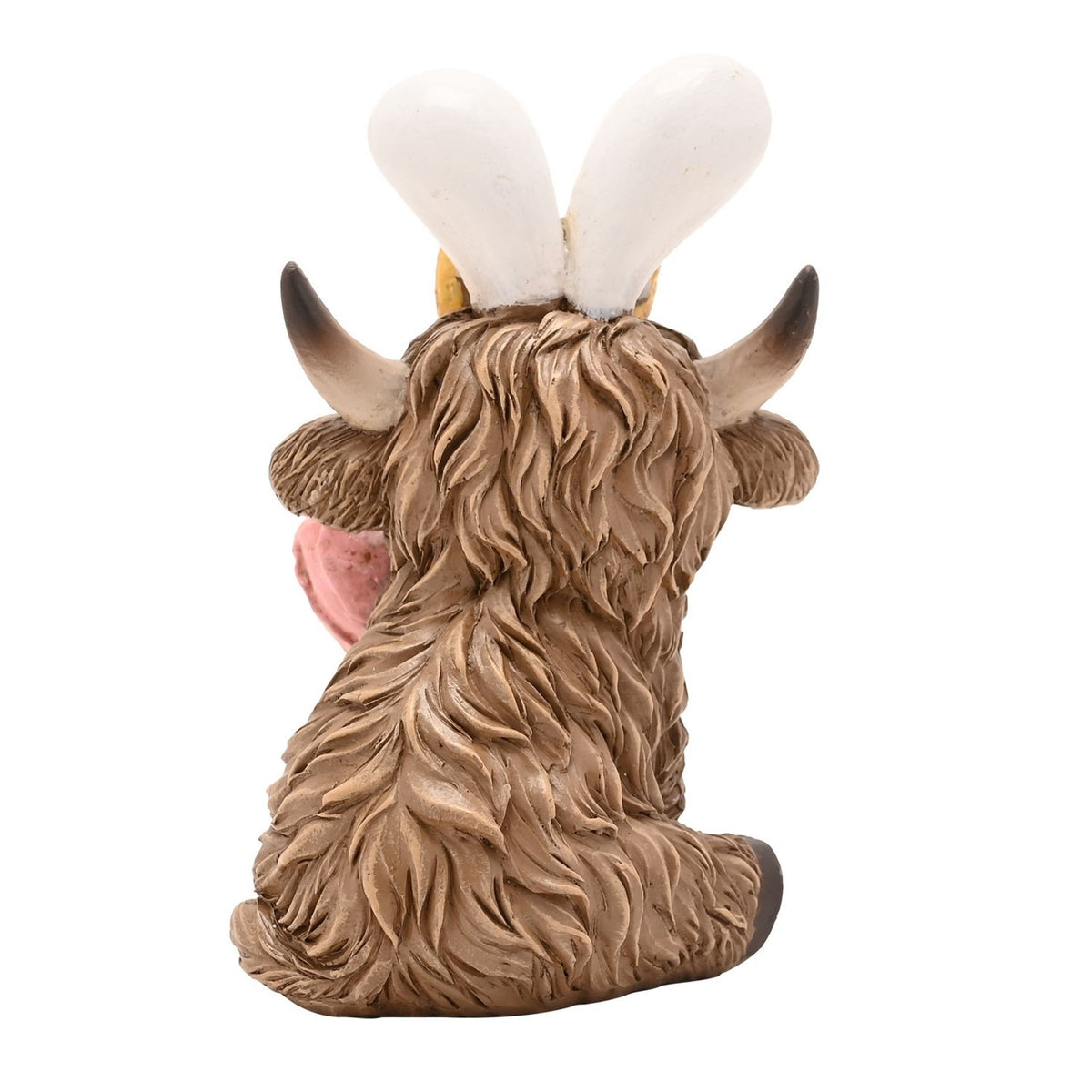 Rear view of the Sitting Highland Cow Easter Bunny resin decoration, showing its shaggy brown coat, curved horns and white bunny ears against a plain white background.