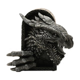 Resin figurine of a roaring dragon head and clawed foot breaking through a scrolled brick archway, finished in grey with deeply sculpted scales, horns and teeth, shown on a plain white background.