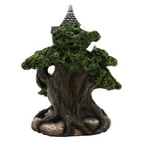 LED Treehouse Resin Light-Up Decoration 19.8cm in grey and green, showing a gnarled tree trunk with textured mossy foliage and a turreted cottage roof peeking through, on a plain white background.