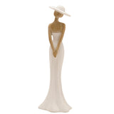 Standing Lady in Wide Hat resin figurine with cream gown and wide-brimmed hat, natural wood-effect hair, shoulders and arms, on a plain white background.