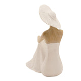 Rear view of the Floor Seated Lady Resin Figurine with Hat, showing a wide-brimmed cream hat, textured cream gown, and natural-finish shoulders, on a plain white background.