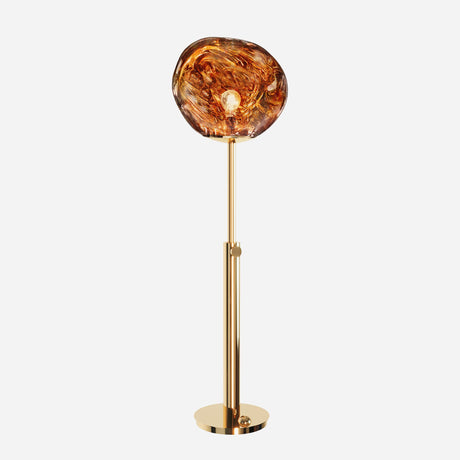 Introducing the Lava Floor Lamp - Gold, a modern masterpiece with a circular, amber-colored glass shade that mimics swirling molten effects. This floor lamp is designed with a sleek gold metal stand and round base, perfect for adding an artistic and organic design touch to any space.