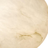 A close-up of the Lucentis 1 Light Globe Alabaster Single Pendant Light reveals a smooth, cream-toned marble surface with subtle beige and light brown veins, evoking timeless elegance in soft white and brass.