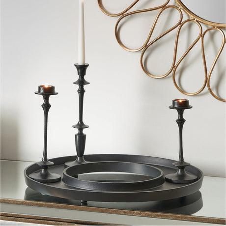 Matt black aluminium ring display platter, 54 x 54cm, styled with black candlesticks on a sideboard beneath a gold decorative wall mirror.
