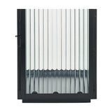 Close-up of a black iron candle lantern with vertical ribbed glass panels and a hinged door, shown against a plain white background.