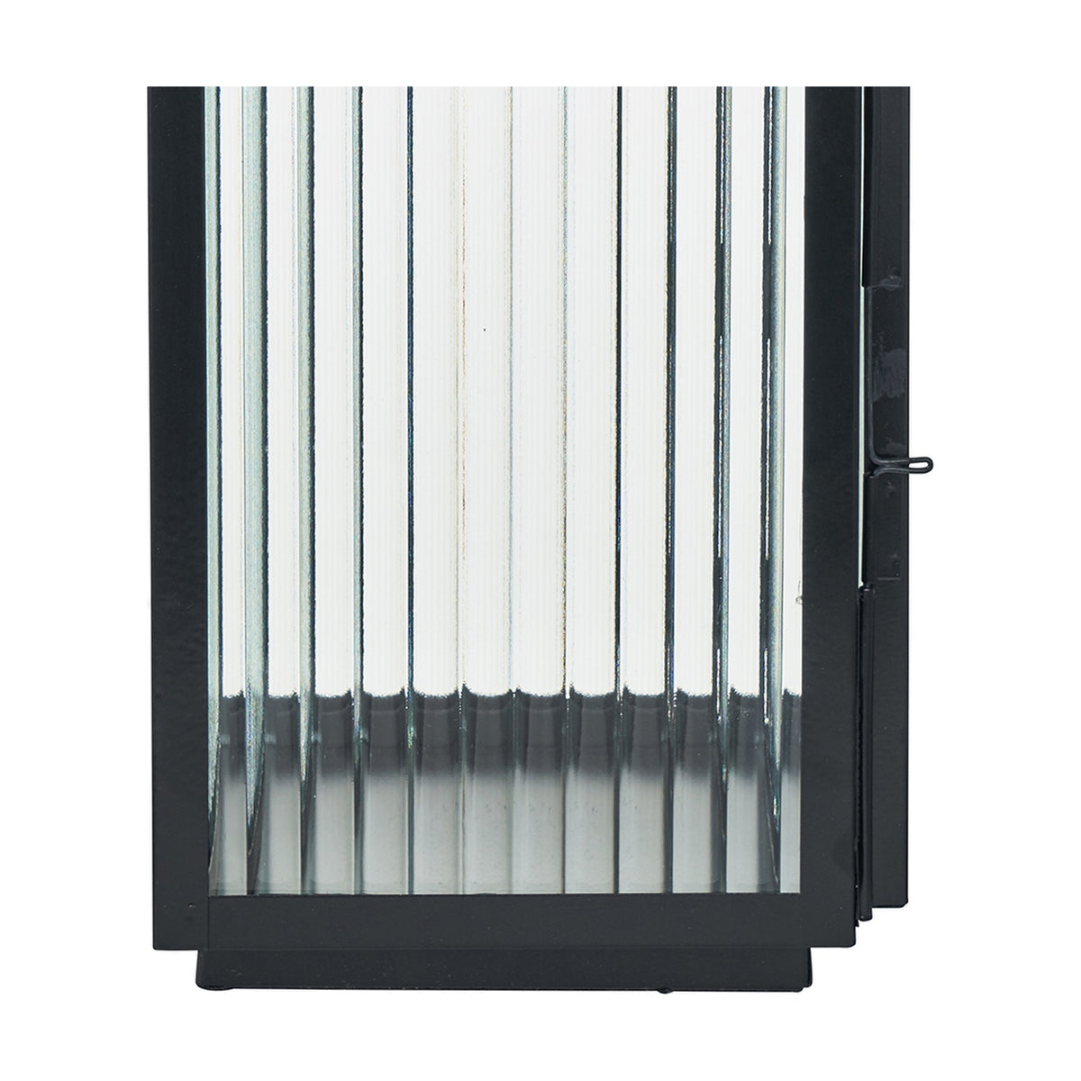 Close-up of a black iron candle lantern with vertical ribbed glass panels, a black metal frame, and visible clasp, on a plain white background.