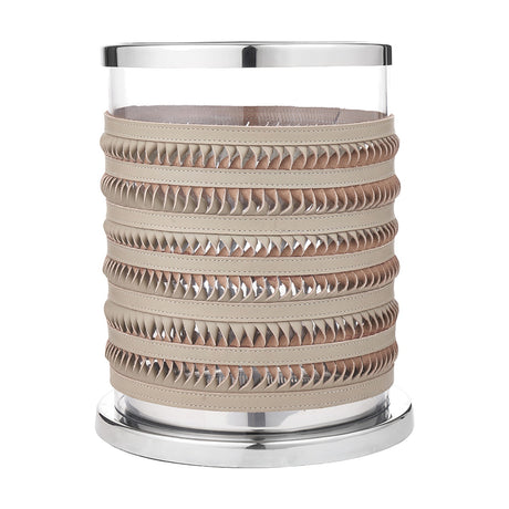Small hurricane lamp with a clear glass cylinder wrapped in grey plaited leather bands, set on a silver metal base and rim, shown on a plain white background.