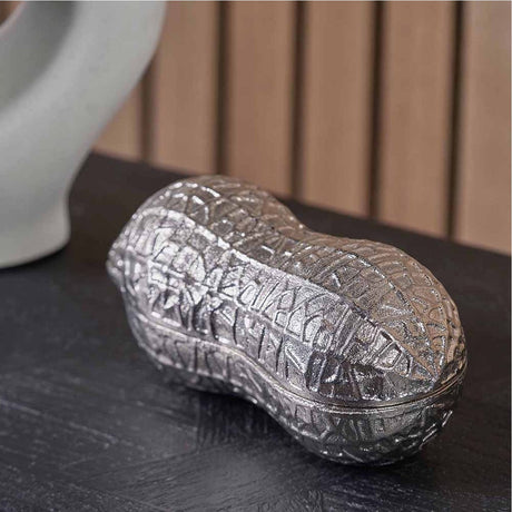 Silver aluminium peanut-shaped lidded trinket bowl, 22cm, with textured cracked-effect finish, shown on a dark wood surface.