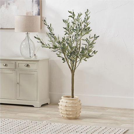 Beige Bobble Fibrestone Decorative Planter (29cm) with textured bobble detailing, holding an artificial olive tree in a light living room setting.