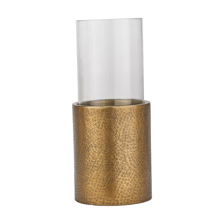 Antique brass finish hurricane lamp, 54cm, with a hammered-texture cylindrical base and tall clear glass chimney, shown against a plain white background.