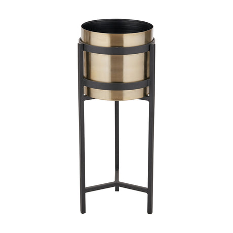 Brass floor planter, 66cm tall, with a round brass bowl held by matt black metal bands on a tall three-legged matt black stand, shown on a plain white background.