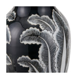 Close-up of the Black & White Feather Ceramic Urn Vase Asteria, showing hand-painted feather leaf detailing on a glossy black ceramic surface with white outlines.