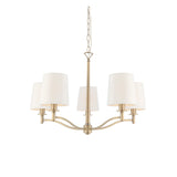 Endon Castwell 5 light pendant in antique brass with vintage white fabric shades on curved arms, suspended from a chain, on a white background.