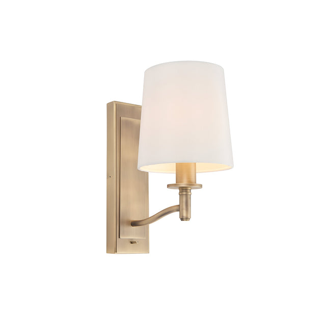 Endon Castwell wall light in matt antique brass with a single arm, vintage white faux-silk shade and toggle switch, on a plain white background.