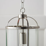 Close-up of the Endon Caldbury pendant light in nickel, showing the top ring, chain suspension, E27 lamp holder and clear glass panels.
