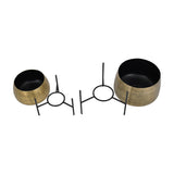 Libra Interiors Etched Brass Set of 2 Standing Planters shown disassembled, with two round brass-finish iron pots beside their black metal tripod leg frames.