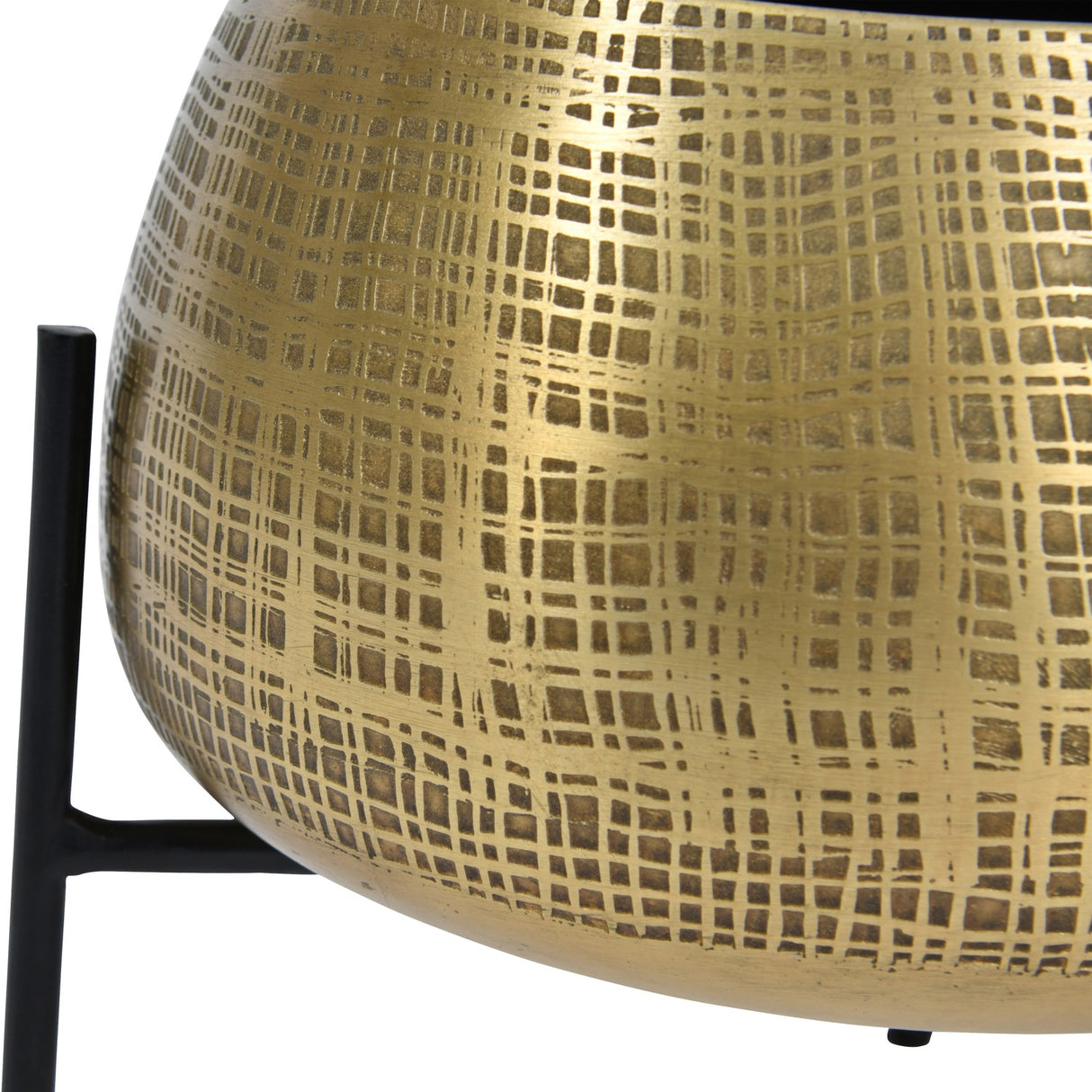 Close-up of Libra Interiors Etched Brass Standing Planter showing the rounded iron pot with cross-hatched etched brass finish on slim black metal legs.
