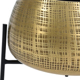 Close-up of Libra Interiors Etched Brass Standing Planter showing the rounded iron pot with cross-hatched etched brass finish on slim black metal legs.