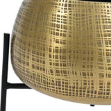 Close-up of Libra Interiors Etched Brass Standing Planter showing the rounded iron pot with cross-hatched brass finish resting on a slim black metal leg.