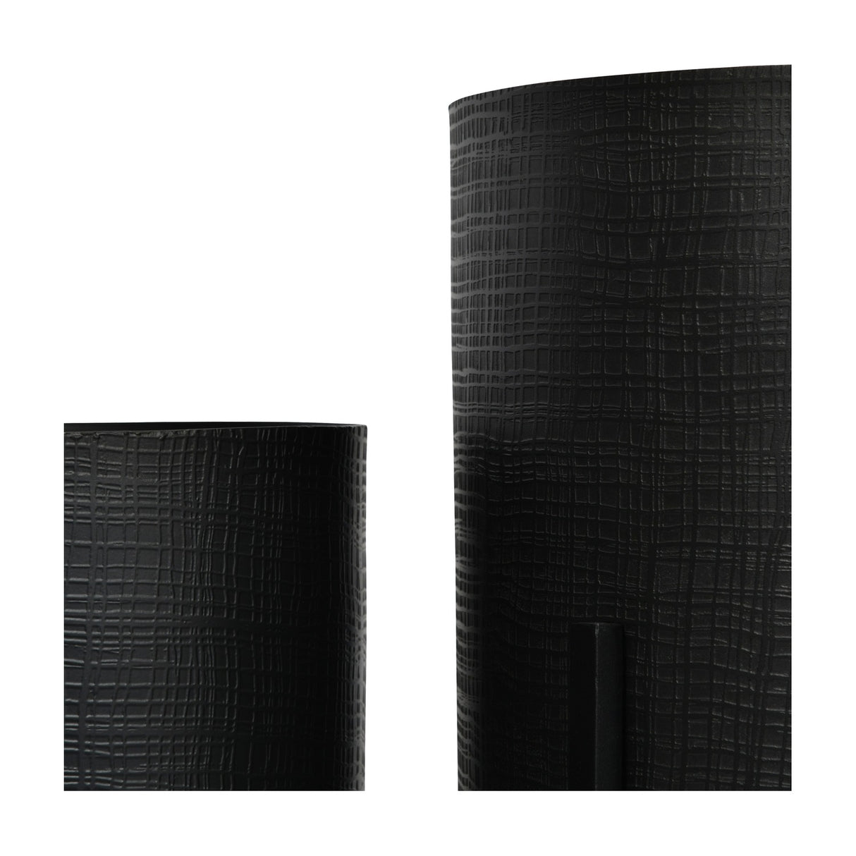 Close-up of Libra Interiors Etched Iron Floor Standing Planters in matt black, showing the cross hatch textured surface on two cylindrical iron pots.