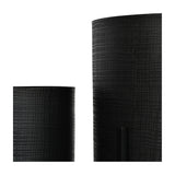 Close-up of Libra Interiors Etched Iron Floor Standing Planters in matt black, showing the cross hatch textured surface on two cylindrical iron pots.