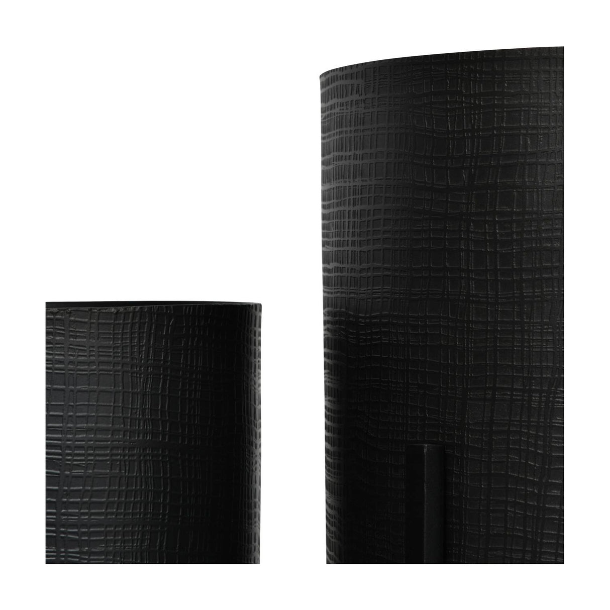 Close-up of Libra Interiors Etched Iron floor standing planters in matt black, showing the cross hatch textured surface on two cylindrical iron pots.