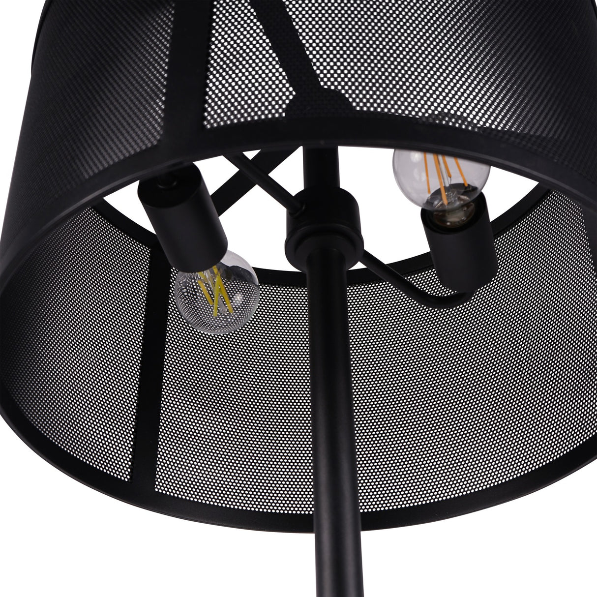 Close-up of Libra Interiors Mesh Shade Iron Floor Lamp in black, showing two exposed filament bulbs inside the perforated drum shade and central stem.