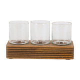 Libra Interiors Glass & Ribbed Wood Candle Holder with three clear votive glasses set in a row on a grooved natural wood base against a white background.