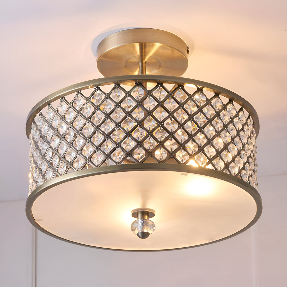 Endon Prescott 3 light crystal flush ceiling light in antique brass, with a drum frame of diamond-set crystals and a frosted glass diffuser.