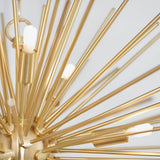 Close-up of the Merrick 9 Light Sputnik Pendant in satin brass, showing radiating metal rods with lit G9 bulbs against a plain white background.